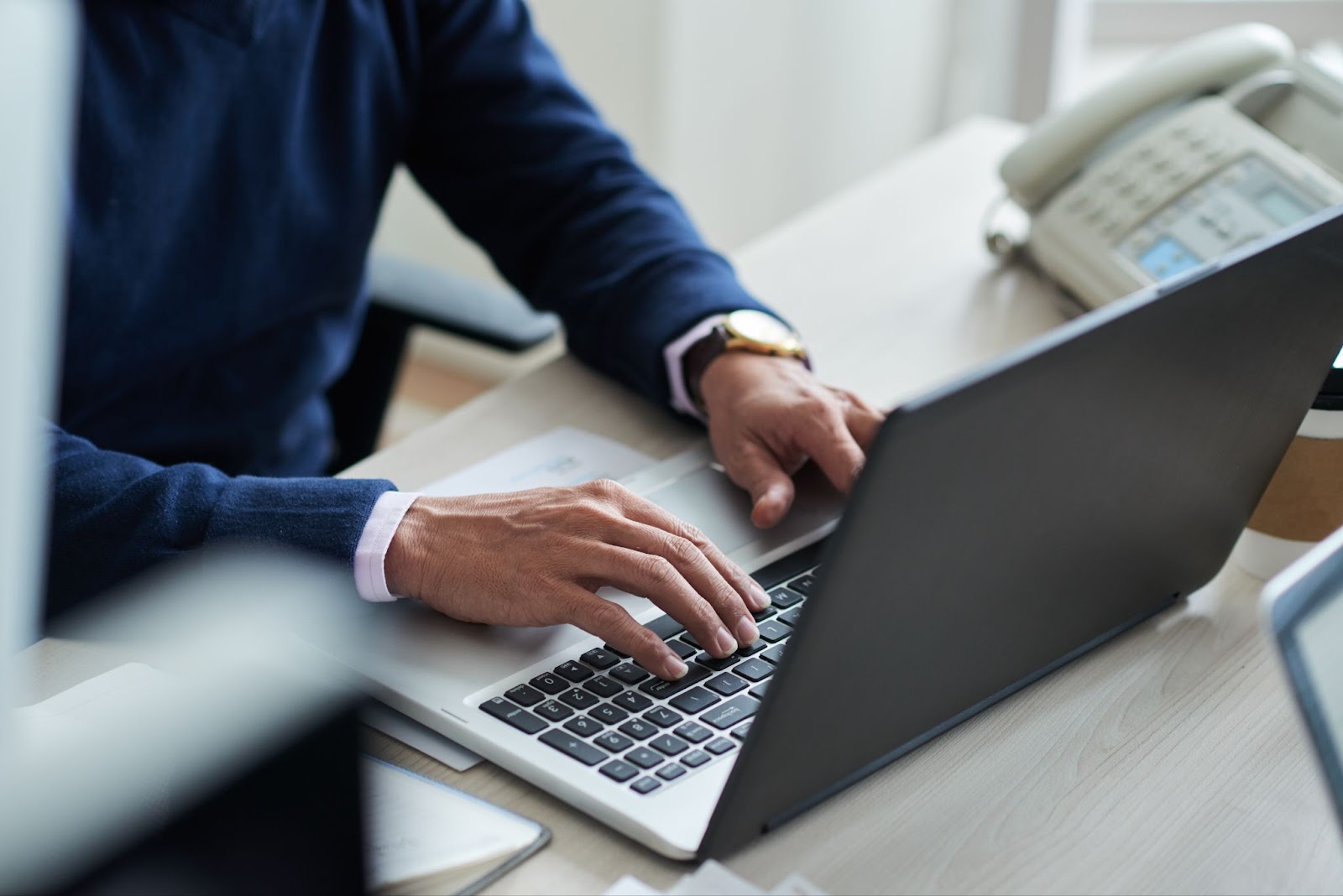 Close up of man typing on computer