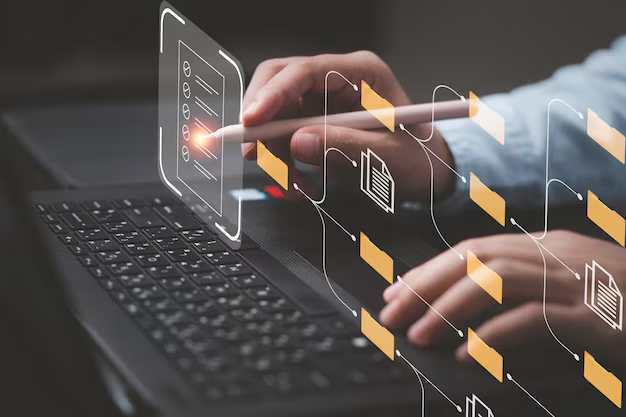 Man working on laptop and touching virtual screen with files